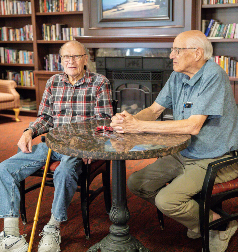 two residents sitting at table