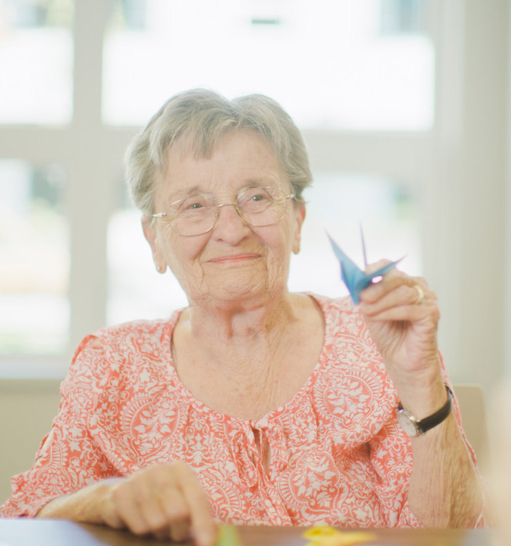 resident with paper crane