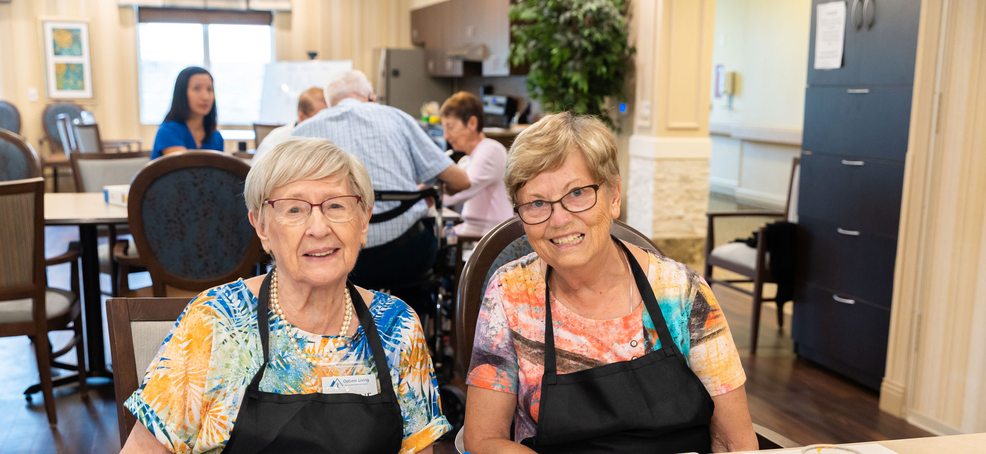 two smiling residents